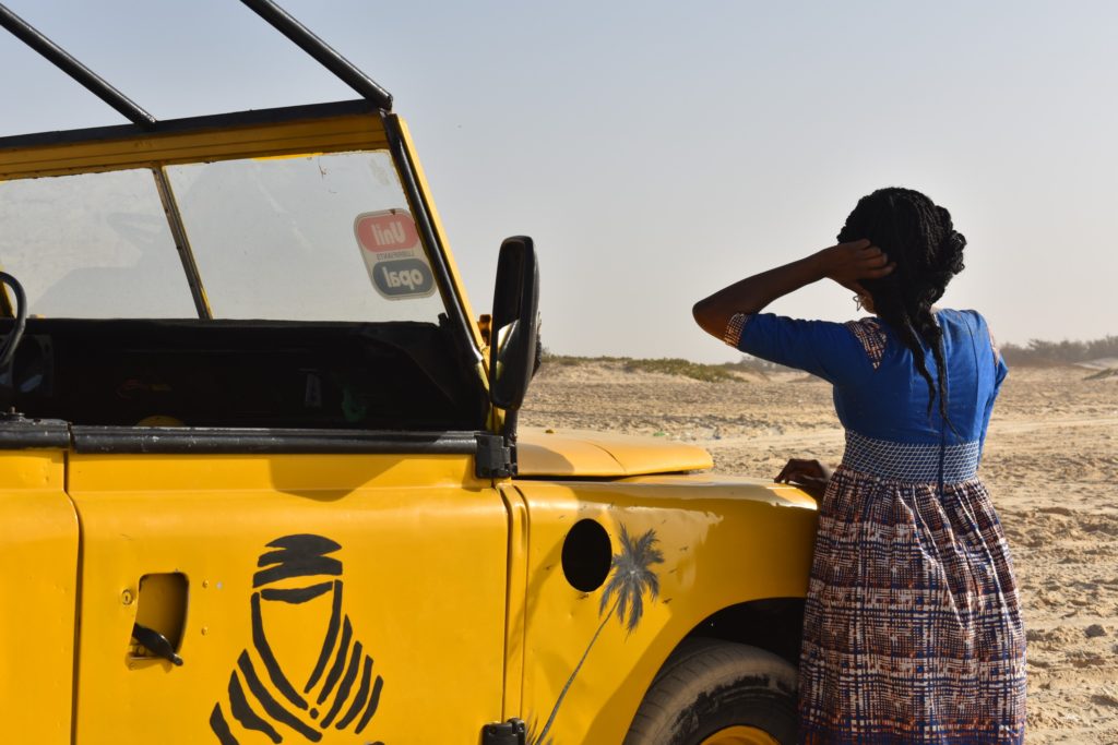 Paris Dakar Rally in Senegal_yellow_atv_pensive_woman