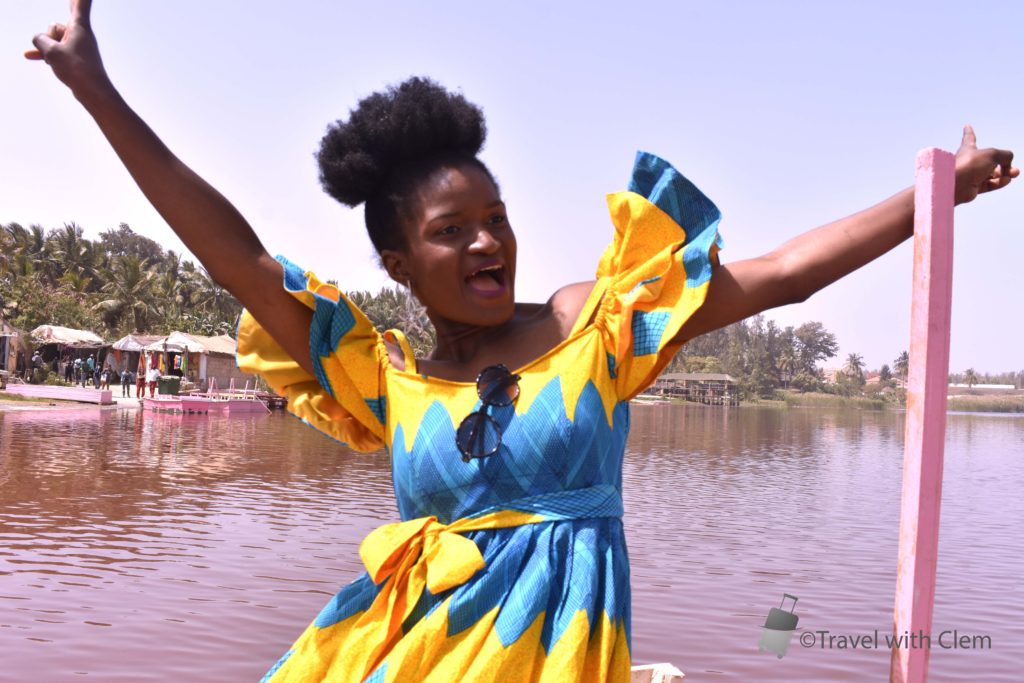 African girl with ankara outfit visiting the lac Rose in Senegal