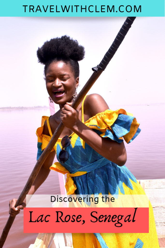 The ultimate guide to visiting the lac rose in senegal_blackgirl_rowing_yellow_dress_boat_africa