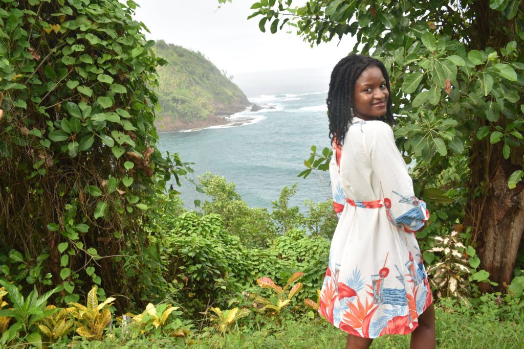 how-to-travel-more-black-caribbean-girl-in-nature-open-back-caribbean-dress-green-pastures-travelwithclem