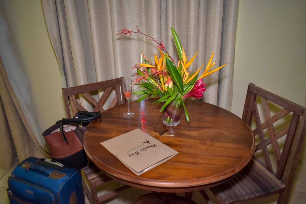 A welcome note and a bouquet of natural flowers at the rosalie Bay eco resort, one of the best eco resorts in the Caribbean