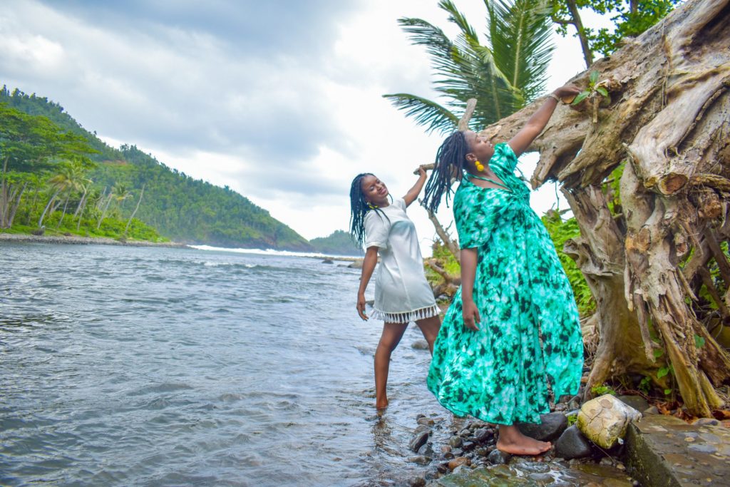Posing at the Rosalie River at Rosalie Bay, one of the best eco resorts in the Caribbean