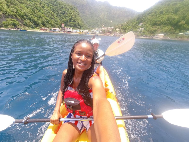 Black girl kayaking in the Caribbean