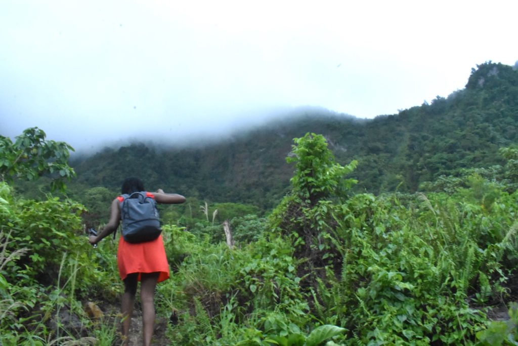 Soufriere, Dominica, Black woman hiking to the Sulphur Springs 