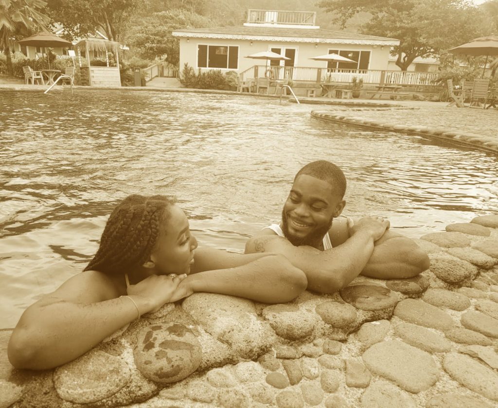 Black couple smiling at each other at a Caribbean eco-resort - Rosalie Bay Dominica