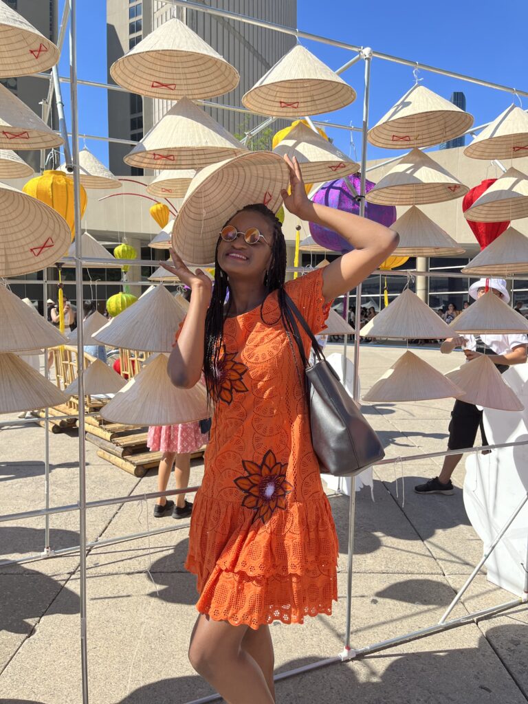 festivals in toronto - wearing a vietnamese traditional hat during the taste of vietnam festival