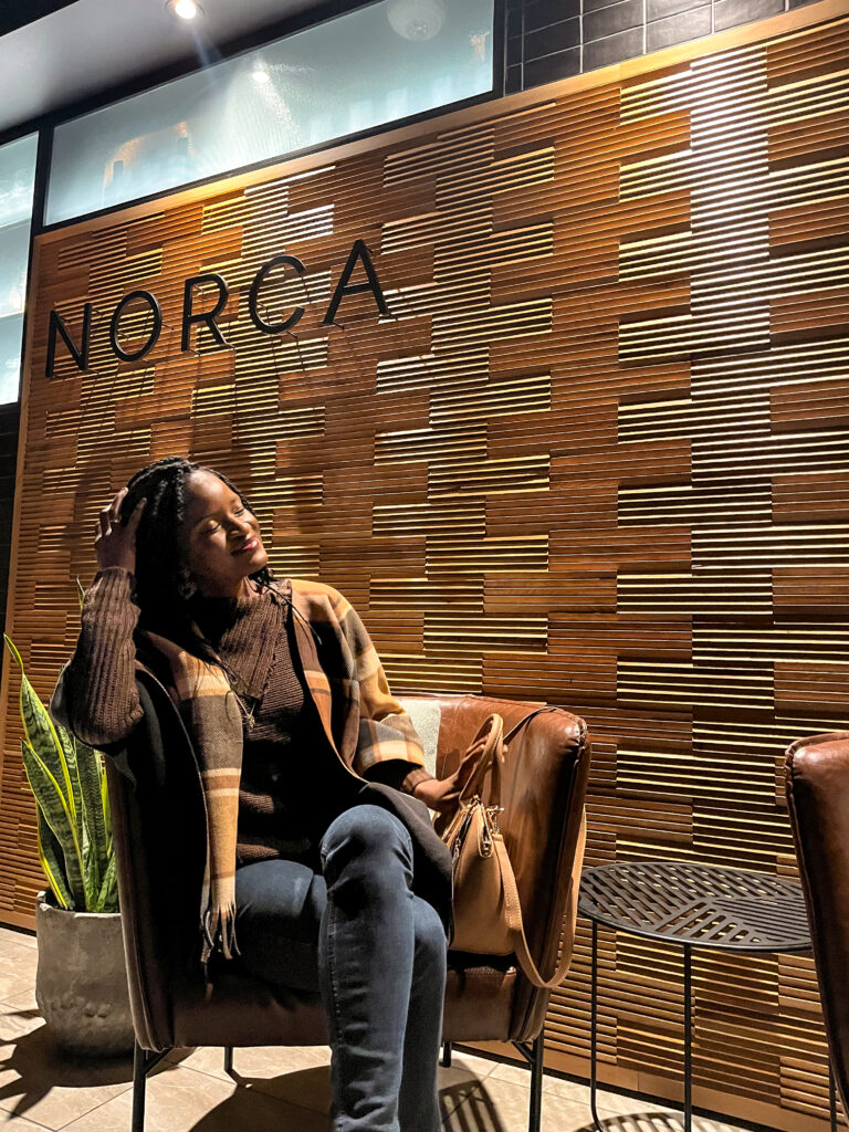 Beautiful black woman having a fancy upscale dinner at one of the Best restaurants downtown ottawa, Norca restaurant, Le Germain hotel - travel with clem