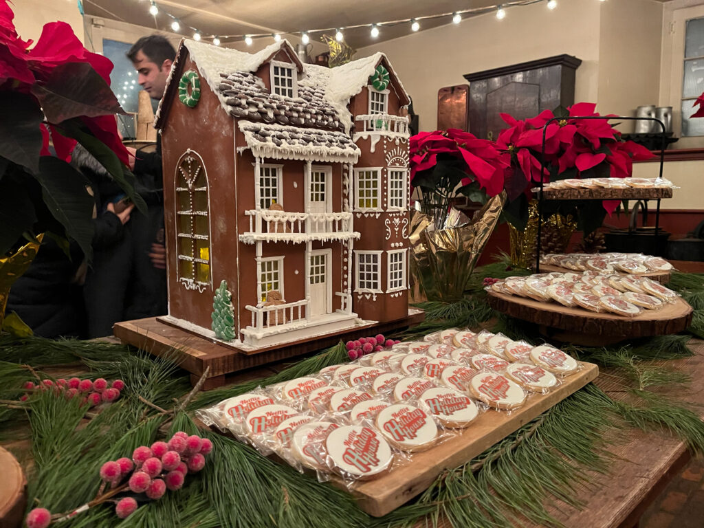  Things to do in Toronto Christmas - Gingerbread house with Christmas cookies at a Christmas table