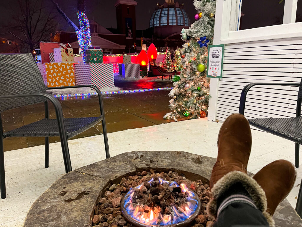 Sitting by the fireplace with winter boots from SoftMoc - Toronto Christmas experiences
