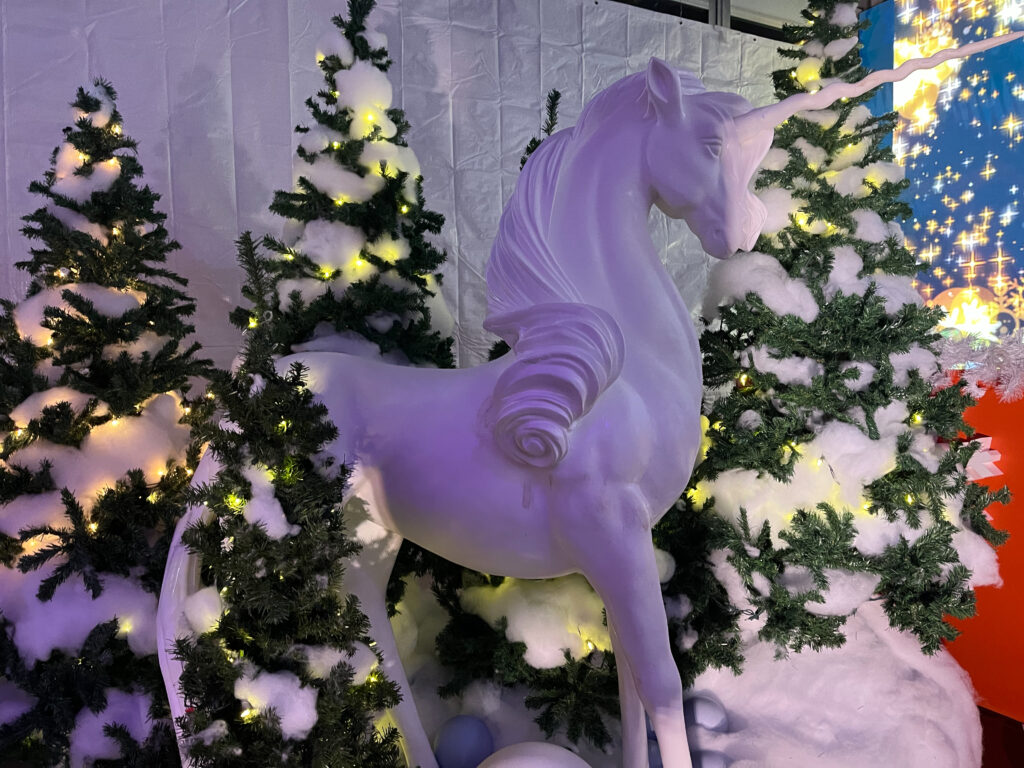 White unicorn display at Casa Loma - Holiday Lights Tour