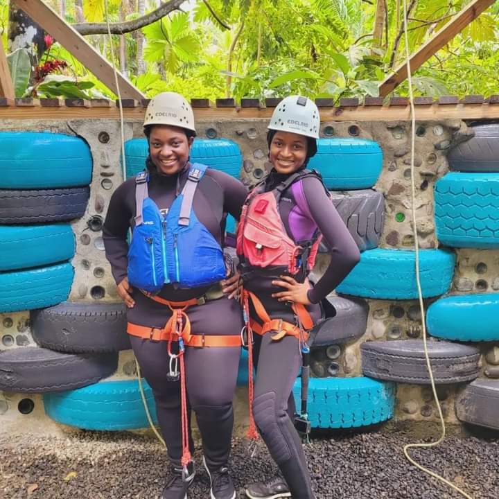 Two black girls, sisters getting ready for a canyoning water adventure in Dominica, the Caribbean with Extreme Dominica