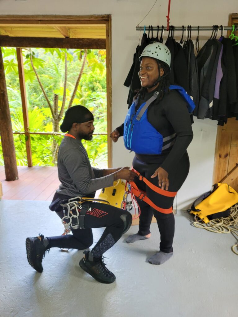 Black girl getting ready for a canyoning water adventure in the Caribbean, Dominica