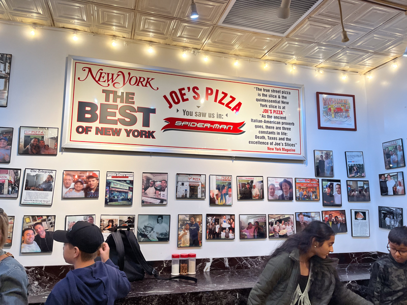 Eating at Joes Pizza in New York City during a new York City summer trip