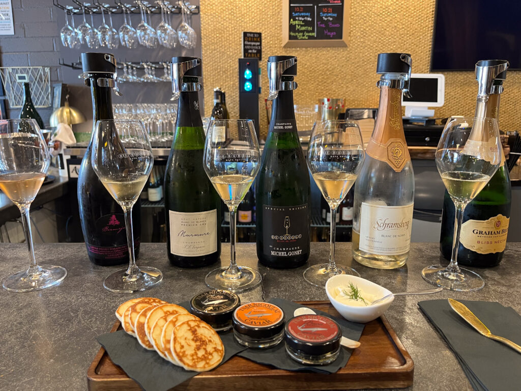 A flight of champagne at the Be Bubbly wine tasting room with Tsar Nicolau caviar - Downtown Napa, California