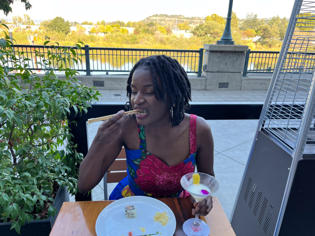 Travel with Clem eating sushi and drinking japanese cocktails at one of the top restaurants downtown Napa, Morimoto Napa - and wearing a blue summer dress by Ngaska Store