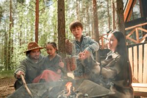 family cooking outdoors