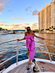 Things to do in Fort Lauderdale - black girl wearing Ngaska outfit during a yacht cruise in Fort Lauderdale