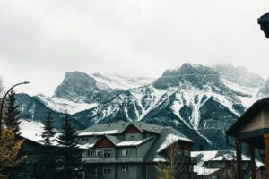 Christmas Bucket List Ideas in Canada - snowy house in the mountain in Canada