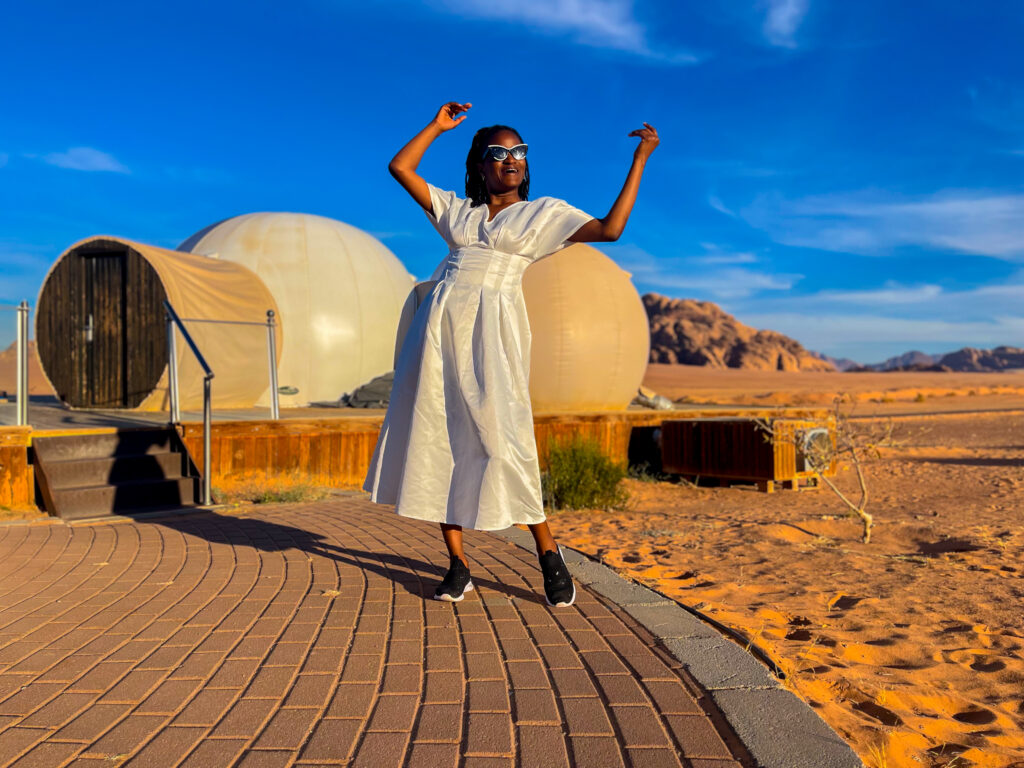 Bible verses about safety - Travel with Clem posing at the UFO luxotel in the Wadi Rum