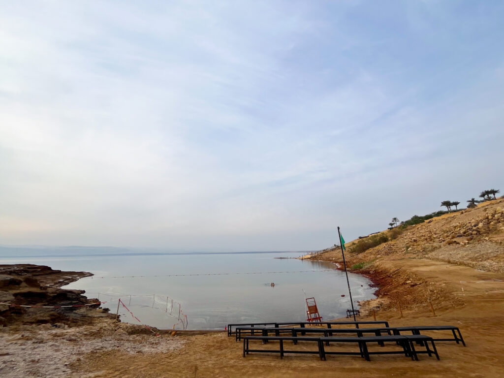 Floating in the dead sea: Panoramic view of the Dead Sea from Jordan with desert mountains in the background
