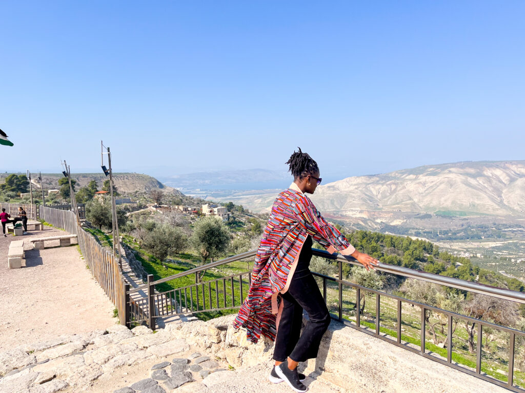 Jordan travel visa: everything you need to know - this is a black beautiful travel influencer posing in front of the Amman Citadel