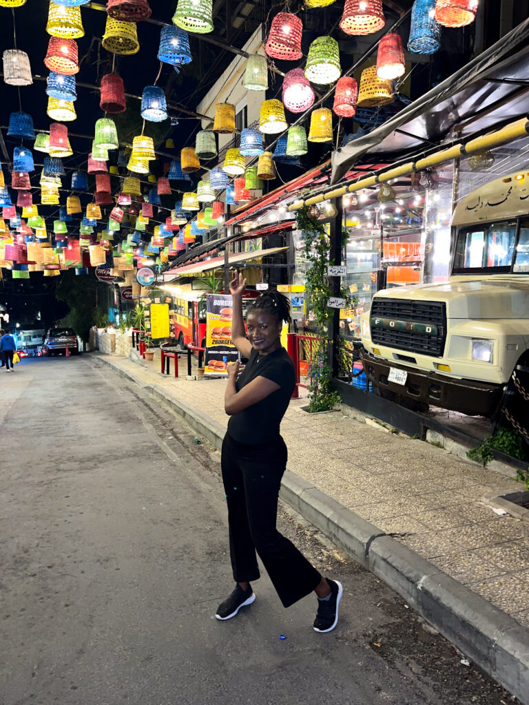 Jordan travel visa - everything you need to know before visiting - Travel with Clem posing at the famous Rainbow street in Amman, Jordan