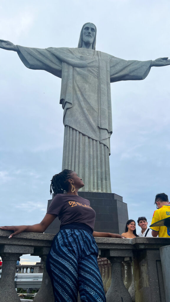 Travel with Clem in front of the Christ the Redeemer statue - Things to do in Rio de Janeiro, Brazil